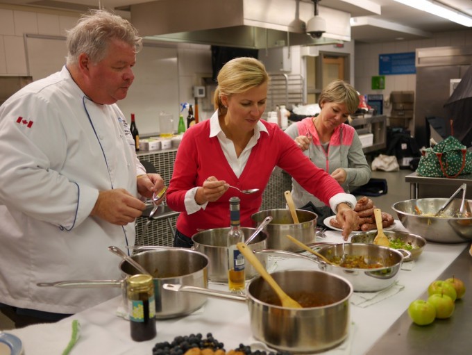 Anna and Michael tasting and judging the preserves at Niagara College